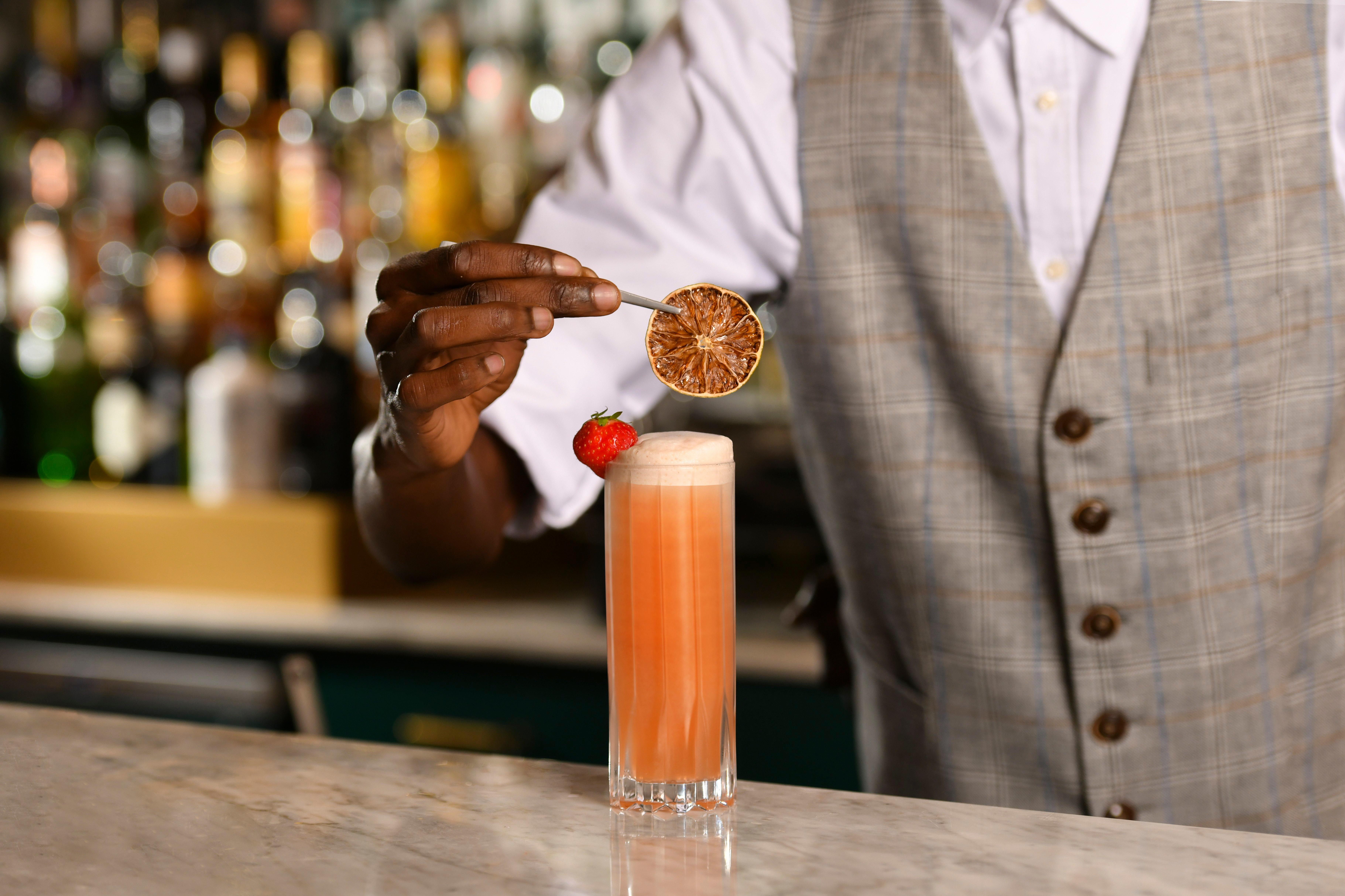 Kimpton Vividora Hotel By Ihg Барселона Екстериор снимка A bartender adding a garnish to a cocktail